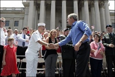 President George W. Bush greets the crowd at the Fourth of July Celebration on the steps of the Capitol in Charleston, West Virginia on Independence day, 2004.