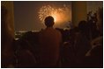 President George W. Bush watches Fourth of July fireworks from the balcony of the White House Monday evening. The Independence Day celebration was preceded by a birthday fete for the President, who will turn 59 on July 6.
