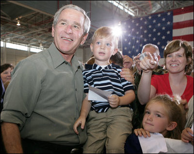 President George W. Bush poses for photos during his visit Wednesday, July 4, 2007, with members of the West Virginia Air National Guard 167th Airlift Wing and their family members in Martinsburg, W. Va. White House photo by Chris Greenberg