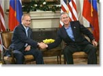 President George W. Bush shakes hands with Russian President Vladimir Putin