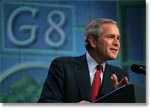 President George W. Bush answers reporters questions during a press conference following the G8