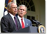 Standing with President George W. Bush, Rep. Porter Goss, R-Fla., 