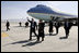 President George W. Bush gives the thumbs-up after Air Force One landed at Bagram Air Base near Kabul, Afghanistan Wednesday, March 1, 2006. The five-hour surprise visit included a meeting with Afghan President Karzai, a ceremonial ribbon-cutting at the U.S. Embassy, and a visit to the troops at Bagram.