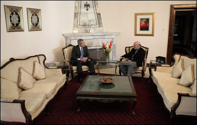 President George W. Bush and Afghan President Hamid Karzai talk Wednesday, March 1, 2006, in the Presidential Palace in Kabul. President and Mrs. Bush made the surprise five-hour stop in Afghanistan en route to India.
