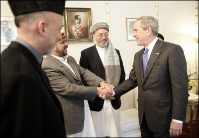 President George W. Bush meets members of President Hamid Karzai's government upon his arrival for a working lunch at the Presidential Palace in Kabul, Afghanistan Wednesday, March 1, 2006.