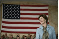 Mrs.Laura Bush appears before an audience of U.S. and Coalition troops, Wednesday, March 1, 2006, during a visit to Bagram Air Base in Afghanistan, where President George W. Bush thanked the troops for their service in defense of freedom.