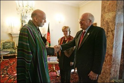 Vice President Dick Cheney shakes hands with newly-elected President Hamid Karzai of Afghanistan before departing Kabul, Afghanistan, Dec. 7, 2004. Vice President Dick Cheney and Lynne Cheney flew to Afghanistan to attend the historic swearing-in ceremony of President Karzai.