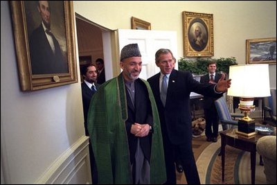 President George W. Bush welcomes Chairman of the Afghan Interim Authority Hamid Karzai to the Oval Office Jan. 28, 2002. “The United States is committed to building a lasting partnership with Afghanistan. We’ll help the new Afghan government provide the security that is the foundation for peace,” said President Bush in a joint press conference with Chairman Karzari.