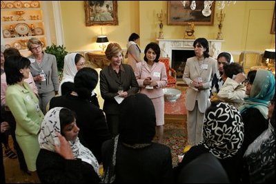 Laura Bush meets with members of the U.S.-Afghan Women’s Council in the Yellow Oval Room June 15, 2004. The Women’s Council was established Jan. 28, 2002, to ensure Afghan women gain the skills and education that were deprived them during the years of Taliban rule.