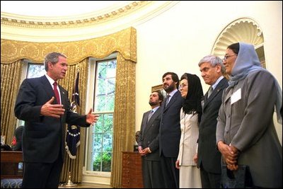 President George W. Bush meets with Afghan ministers in the Oval Office July 24, 2002. Pictured from left, are: Foreign Minister Abdullah Abdullah; Minister of Commerce Mustafa Kazemi; Minister of Health Suhaila Siddiq; Minister of Women’s Affairs Habiba Sorabi; Minister of Reconstruction Mohammad Amin Farhang; Minister of Higher Education Sharief Fayes; and Minster of Rural Development Mohammad Hanif Atmar.