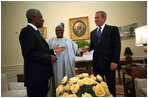 President George W. Bush meets with United Nations Secretary General Kofi Annan, left, and President Olusegun Obasanjo of Nigeria in the Oval Office May 11, 2001. President Bush.s commitment to Africa started long before the announcement of his plan to fight AIDS. He has met with 25 African heads of state and has a wide range of discussions about HIV/AIDS, economy and peace in the region.