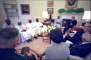 President George W. Bush hosts a visit from Nigerian President Olusegun Obasanjo to the Oval Office May 11, 2001. White House photo by Eric Draper.