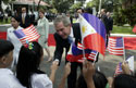 President George W. Bush, Philippine President Gloria Arroyo and Laura Bush greet school children during a welcoming ceremony at Malacanang Palace in Manila, Philippines, Saturday, Oct. 18, 2003. White House photo by Paul Morse.