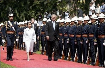 President George W. Bush and Philippine president Gloria Arroyo review troops during a welcoming ceremony at Malacanang Palace in Manila, Philippines, Saturday, Oct. 18, 2003. White House photo by Paul Morse