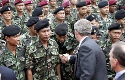 President George W. Bush greets Thai troops after his remarks at the Royal Thai Army Headquarters in Bangkok, Thailand, Sunday, Oct. 19, 2003. White House photo by Paul Morse