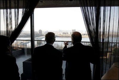 President George W. Bush looks at the cityscape with Canadian Prime Minister Paul Martin during a lunch meeting in Ottawa, Canada, Nov. 30, 2004. 