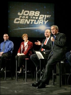 President George W. Bush speaks with participants during a discussion on job training and the economy at Owens Community College in Perrysburg Township, Ohio, Wednesday, Jan. 21, 2004.