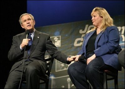President George W. Bush introduces student Rebecca Albritton during a discussion on job training and the economy at Owens Community College in Perrysburg Township, Ohio, Wednesday, Jan. 21, 2004.