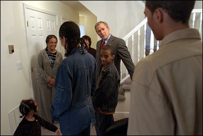 President George W. Bush visits with Pearl Cerdan and her four children in Ardmore, Pa., March 15, 2004. Ms. Cerdan, a first-time homebuyer, moved into her Spring Avenue Development home in December of 2003.