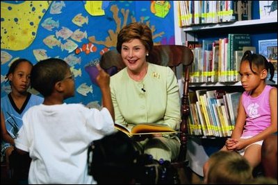 Laura Bush answers questions from a little boy during her reading of "Book, Book, Book" at the Chattanooga-Hamilton Bicentennial Library in Chattanooga, Tenn., June 20, 2003.
