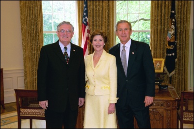President George W. Bush and Laura Bush congratulate 2003 Maine Teacher of the Year Barry Gene Sprague in the Oval Office Wednesday, April 30, 2003. White House Photo by Eric Draper