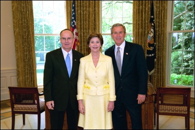President George W. Bush and Laura Bush congratulate 2003 Maine Teacher of the Year Tommy Campbell in the Oval Office Wednesday, April 30, 2003. White House Photo by Eric Draper