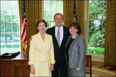 President George W. Bush and Laura Bush congratulate 2003 Maine Teacher of the Year Barb Stoflet in the Oval Office Wednesday, April 30, 2003. White House Photo by Eric Draper