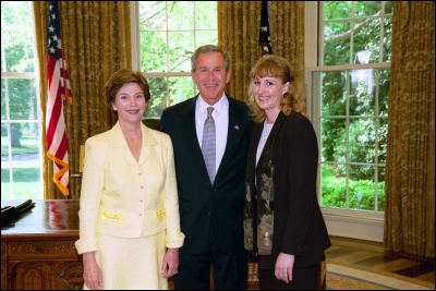 President George W. Bush and Laura Bush congratulate 2003 Maine Teacher of the Year Carrie Carpenter in the Oval Office Wednesday, April 30, 2003. White House Photo by Eric Draper