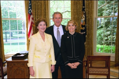 President George W. Bush and Laura Bush congratulate 2003 Maine Teacher of the Year Wendy Nelson Kauffman in the Oval Office Wednesday, April 30, 2003. White House Photo by Eric Draper