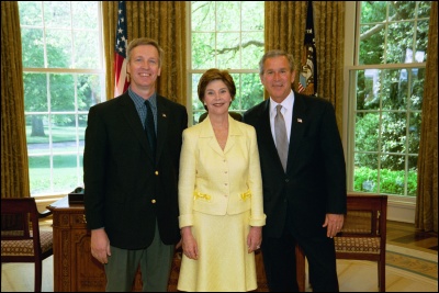President George W. Bush and Laura Bush congratulate 2003 Maine Teacher of the Year Eric Charles Stemle in the Oval Office Wednesday, April 30, 2003. White House Photo by Eric Draper