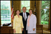 President George W. Bush and Laura Bush congratulate the 2003 National Teacher of the Year Betsy Rogers in the Oval Office Wednesday, April 30, 2003. Rodgers is a 1st and 2nd grade teacher at Leeds Elementary School in Leeds, Ala. White House Photo by Eric Draper