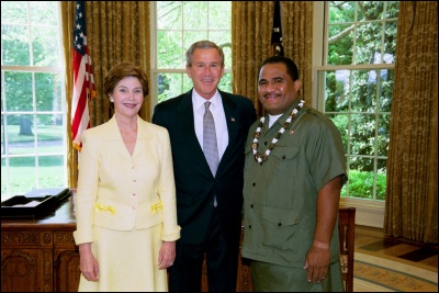 President George W. Bush and Laura Bush congratulate 2003 American Samoa Teacher of the Year Tupulua Ta'ase Jr. in the Oval Office Wednesday, April 30, 2003. White House Photo by Eric Draper