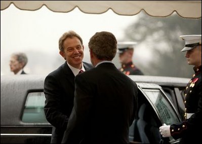 President George W. Bush welcomes British Prime Minister Tony Blair upon his arrival to the White House Friday, Jan. 31, 2003.