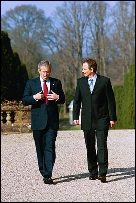  President Bush and Prime Minister Tony Blair of Great Britain walk on the grounds at Hillsborough Castle. Hillsborough, Northern Ireland, April 8, 2003.