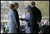 Arriving for the official ceremonial welcome for America's State Visit, President George W. Bush and Laura Bush are greeted by Her Majesty Queen Elizabeth and Prince Philip, Duke of Edinburgh, at Buckingham Palace in London Wednesday, Nov. 19, 2003. White House photo by Eric Draper