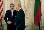 During his visit to Lithuania, President Bush received the Order of Vytautas the Great from President Adamkus at the Prezidentura in Vilnius, Lithuania, Nov. 23, 2002. The medal is given to individuals whose contributions have benefited the Lithuanian nation or the welfare of mankind. White House photo by Paul Morse