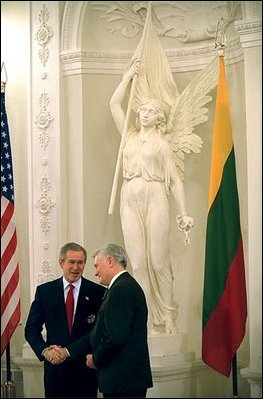 During his visit to Lithuania, President Bush received the Order of Vytautas the Great from President Adamkus at the Prezidentura in Vilnius, Lithuania, Nov. 23, 2002. The medal is given to individuals whose contributions have benefited the Lithuanian nation or the welfare of mankind. White House photo by Paul Morse