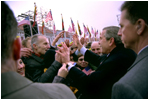 President George W. Bush greets Lithuanians in person at the Rotuse Square in the center of Vilnius, Lithuania, Nov. 23, 2002. 'This is a great day in the history of Lithuania, in the history of the Baltics, in the history of NATO, and in the history of freedom,' said President Bush in his remarks. 'And I have the honor of sharing this message with you: We proudly invite Lithuania to join us in NATO, the great Atlantic Alliance.' White House photo by Paul Morse