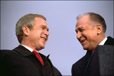 President Bush and President Iliescu address thousands of Romanians in Revolution Square Nov. 23, 2002. 'Mr. President, citizens of Romania, Laura and my visit to your beautiful country has been short; but the friendship, and soon the alliance between our countries will endure,' said President Bush during his remarks. White House photo by Eric Draper