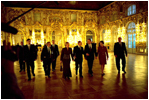 Before their bilateral meetings, President Putin and Lyudmila Putin escort President Bush and Laura Bush through the Great Hall at Catherine Palace in St. Petersburg, Russia, Nov. 22, 2002. White House photo by Eric Draper