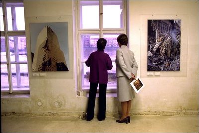 Laura Bush and Meda Mladek look over the rushing waters of the Vlatva River from an exhibit in Mladek's museum in Prague Thursday, November 21, 2002.The museum, known as the Kampa Museum, was severly damaged by flooding in August. The collection features artists who worked under the Soviet occupied government. A special exhibit on Sept. 11, 2001, sponsored by the U.S. Embassy, was on display in the flood-ravaged rooms of the museum. White House photo by Susan Sterner.