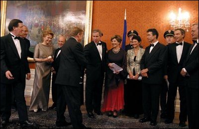 President George W. Bush and Mrs. Bush congratulate Czech Republic President Vaclav Havel during a gift presentation before a dinner for NATO leaders at Prague Castle in Prague, Czech Republic, Nov. 20. 