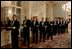 Waiters stand in line to serve attendees of a dinner hosted by the Czech Republic for NATO leaders at Prague Castle in Prague, Czech Republic on Nov. 20. 