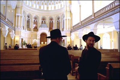 Leaders of the Jewish Community in St. Petersburg, Russia, stand inside the Grand Choral Synagogue while President Bush and Laura Bush tour restoration of the synagogue, the only Jewish house of worship in a city of 4.5 million people.