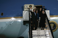 Waving to the crowd, President and Mrs. Bush and Latvia's President Vaira Vike-Freiberga deplane Air Force One Friday night, May 6, 2005, after the Bushes arrived in Riga, Latvia for the first of four European stops.
