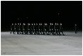 Latvian troops arrive to welcome President and Mrs. George W. Bush to Riga International Airport Friday, May 6, 2005.