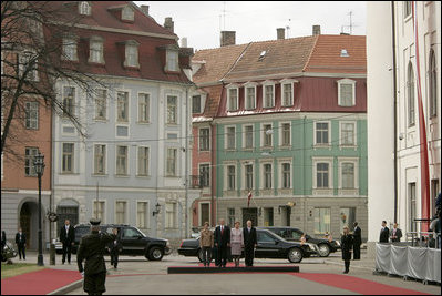President George W. Bush and Laura Bush participate in a ceremony with Latvia's President Vaira Vike-Freiberga and her husband Imants Freibergs at Riga Castle, Riga, May 7, 2005.
