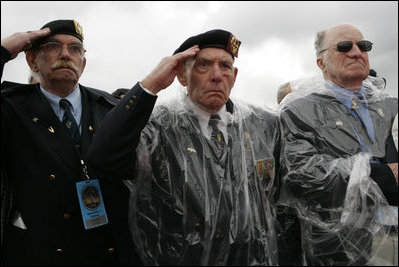 Veterans of World War II salute President George W. Bush Sunday, May 8, 2005, during a celebration at the Netherlands American Cemetery in Margraten, Netherlands, honoring those who served 60 years ago.