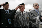 Veterans of World War II salute President George W. Bush Sunday, May 8, 2005, during a celebration at the Netherlands American Cemetery in Margraten, Netherlands, honoring those who served 60 years ago.