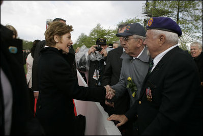 First Lady Laura Bush shakes hands with a veteran following a ceremony Sunday, May 8, 2005, in Margraten, Netherlands honoring those who served in World War II. The ceremony highlighted the President and First Lady’s visit to the Netherlands before moving on to Moscow.